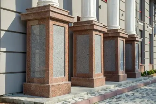 Architectural decorative concrete pillars with polished granite inlays, a signature feature by Northland Concrete.