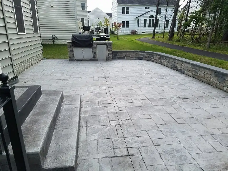 Northland Concrete designs stylish gravel and stone patios, perfect for relaxed outdoor dining and entertaining.